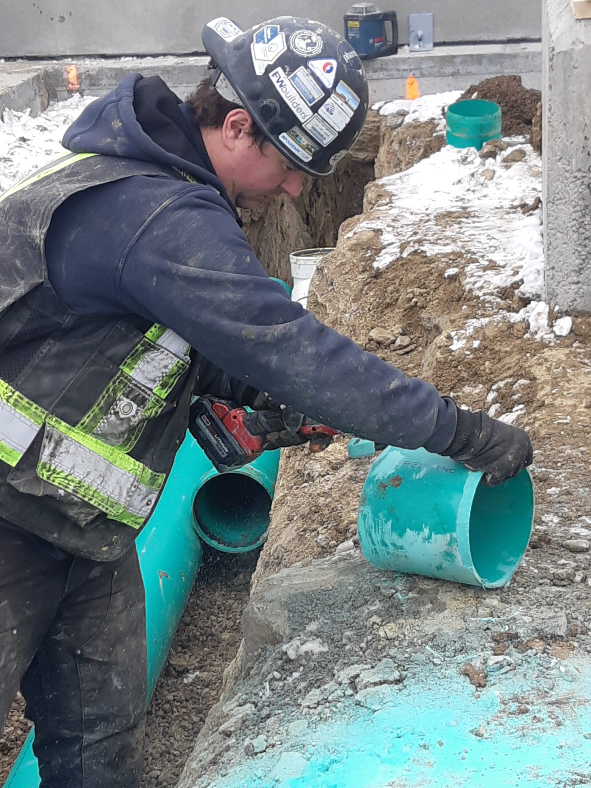 Analog Mechanical plumber on a Calgary commercial job site